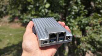 A person holding a ZimaBoard 2