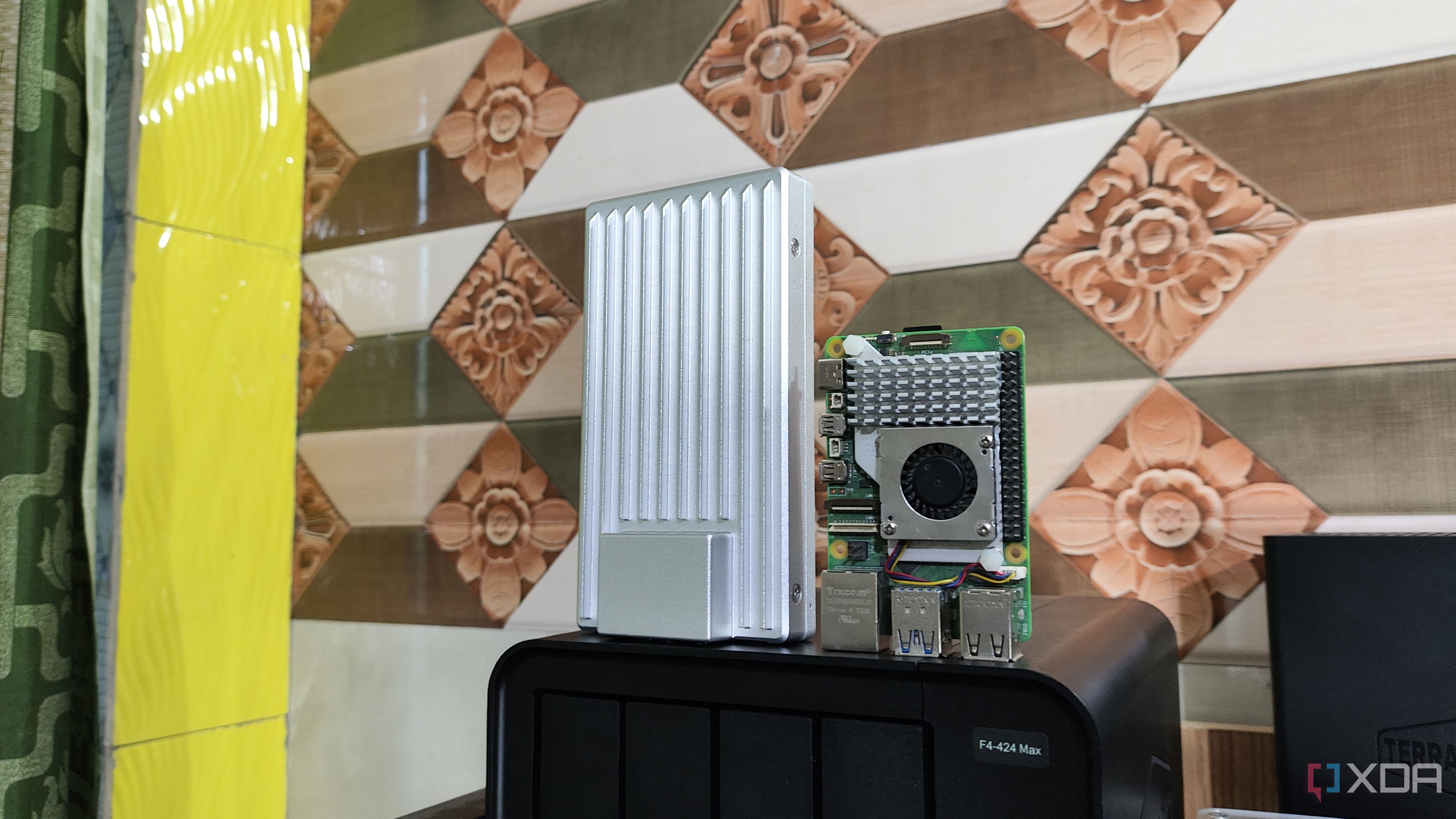 The ZimaBoard 2 standing upright next to a Raspberry Pi 6