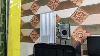 The ZimaBoard 2 standing upright next to a Raspberry Pi 6
