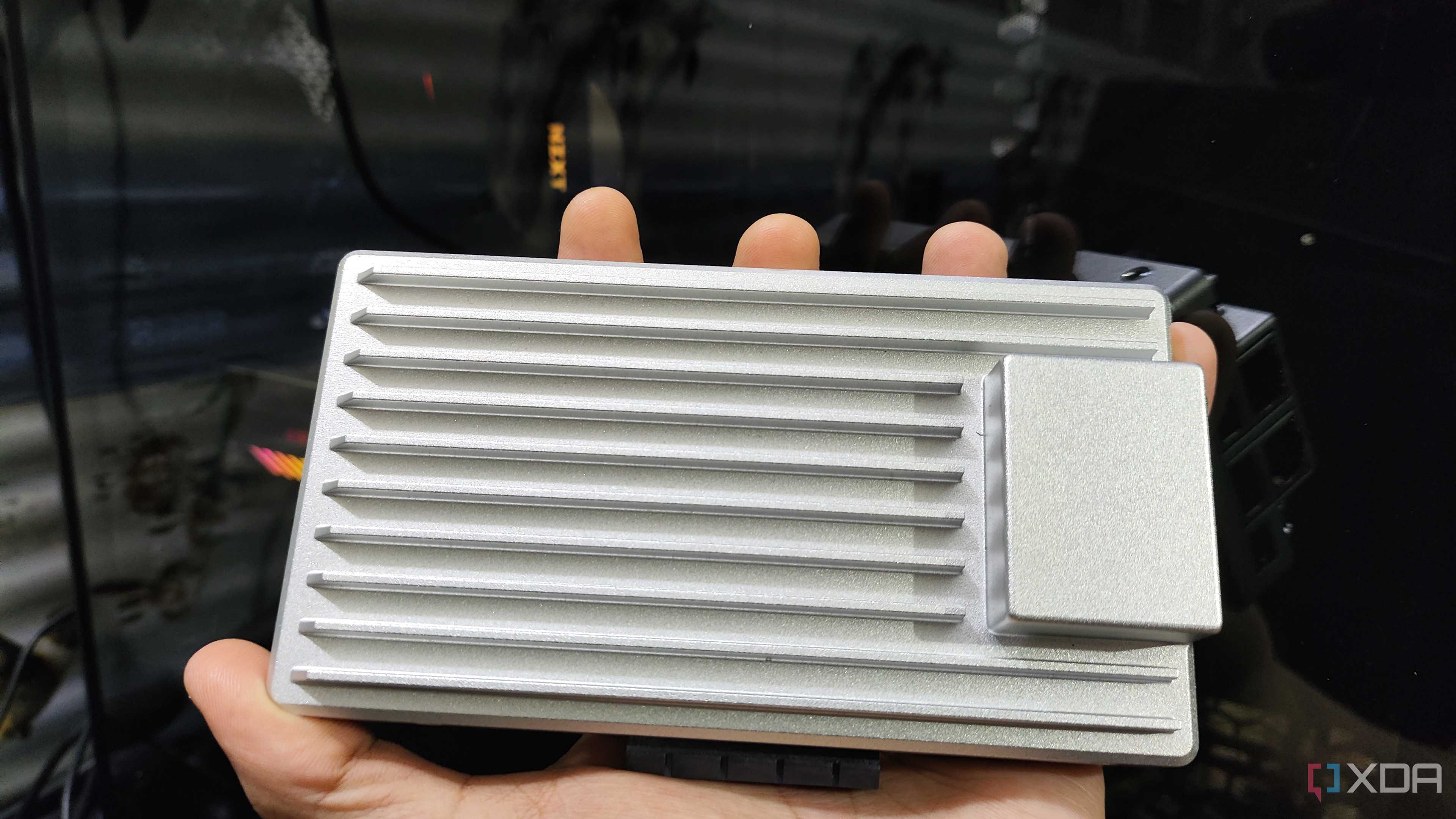 A person holding a ZimaBoard 2
