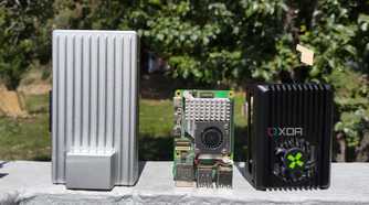 A ZimaBoard 2 placed next to a Raspberry Pi 5 and Radxa X4