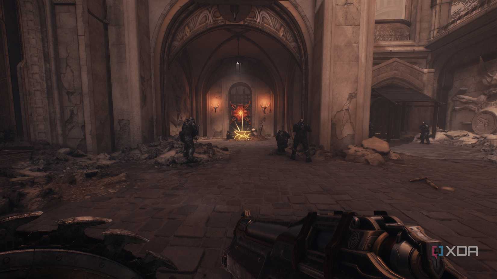 A gold crate under a heated metal cross in Doom: The Dark Ages.