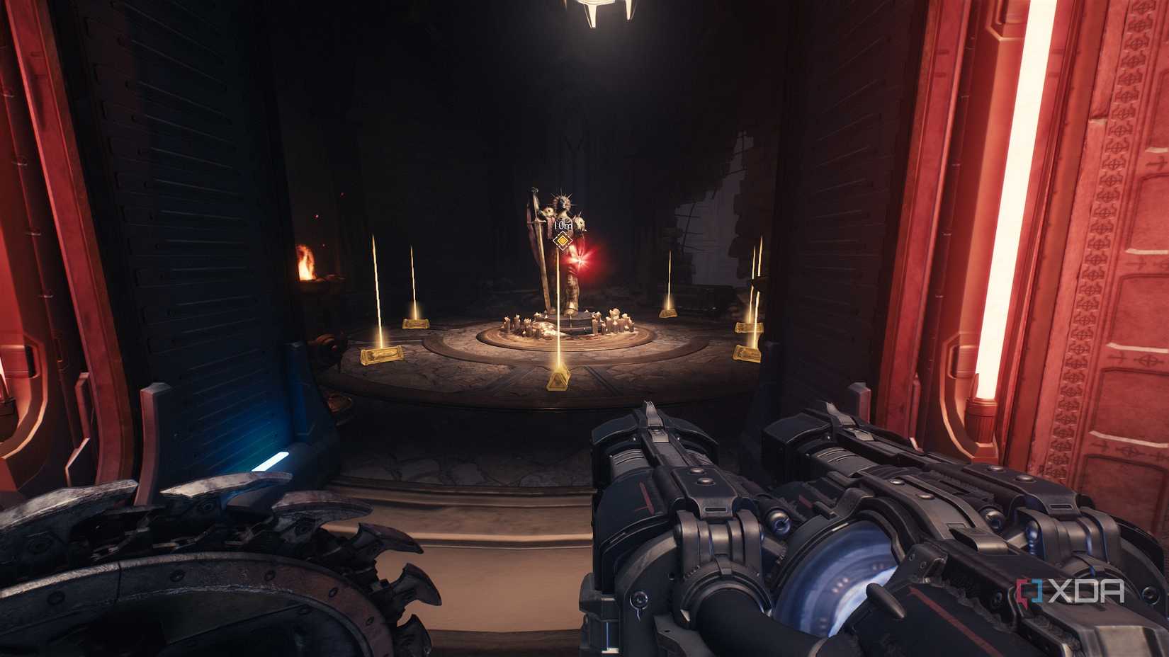 A statue with a red ruby and gold bars surrounding it in Doom: The Dark Ages.