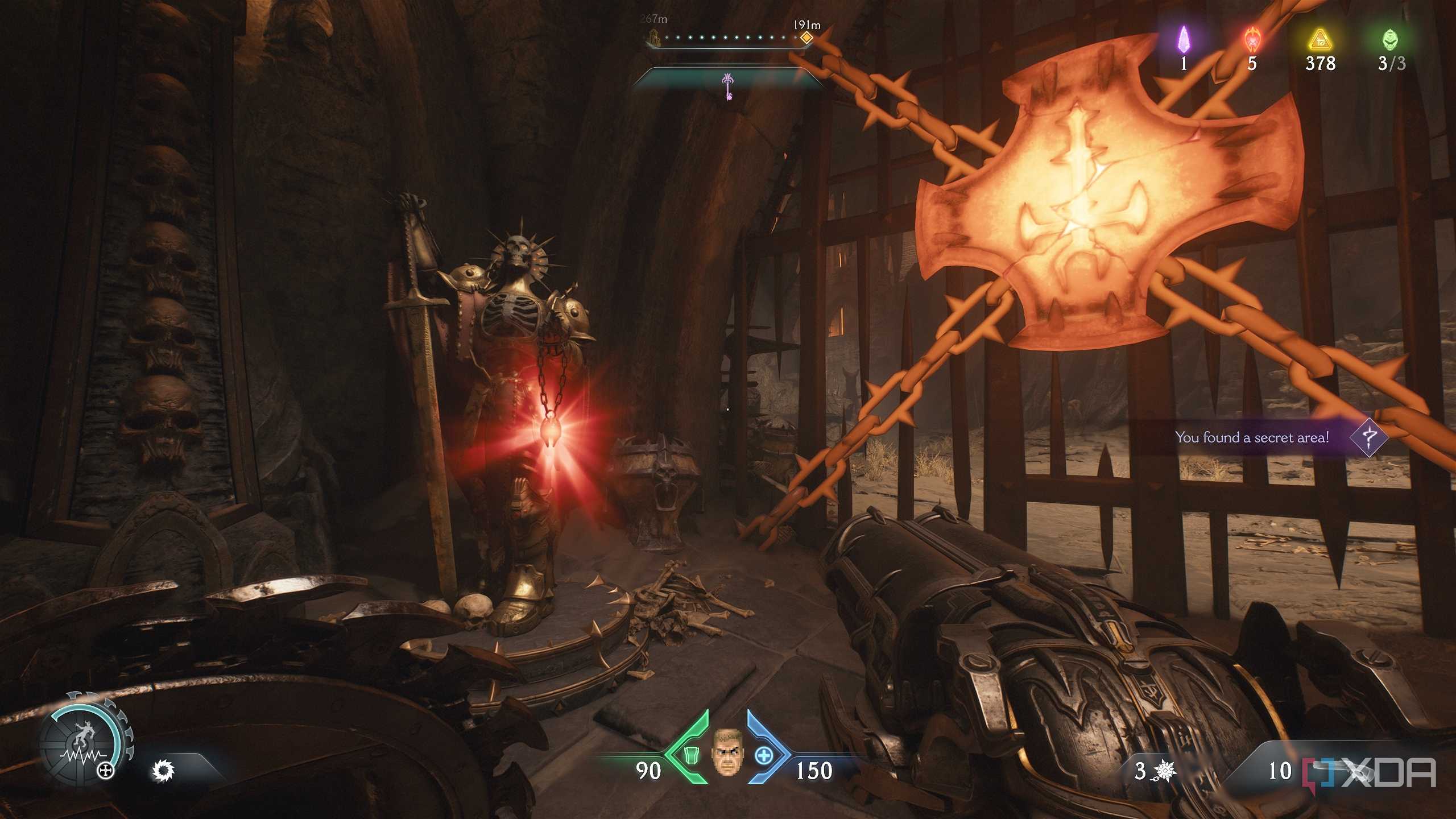 A red ruby statue next to a heated metal cross in Doom: The Dark Ages.
