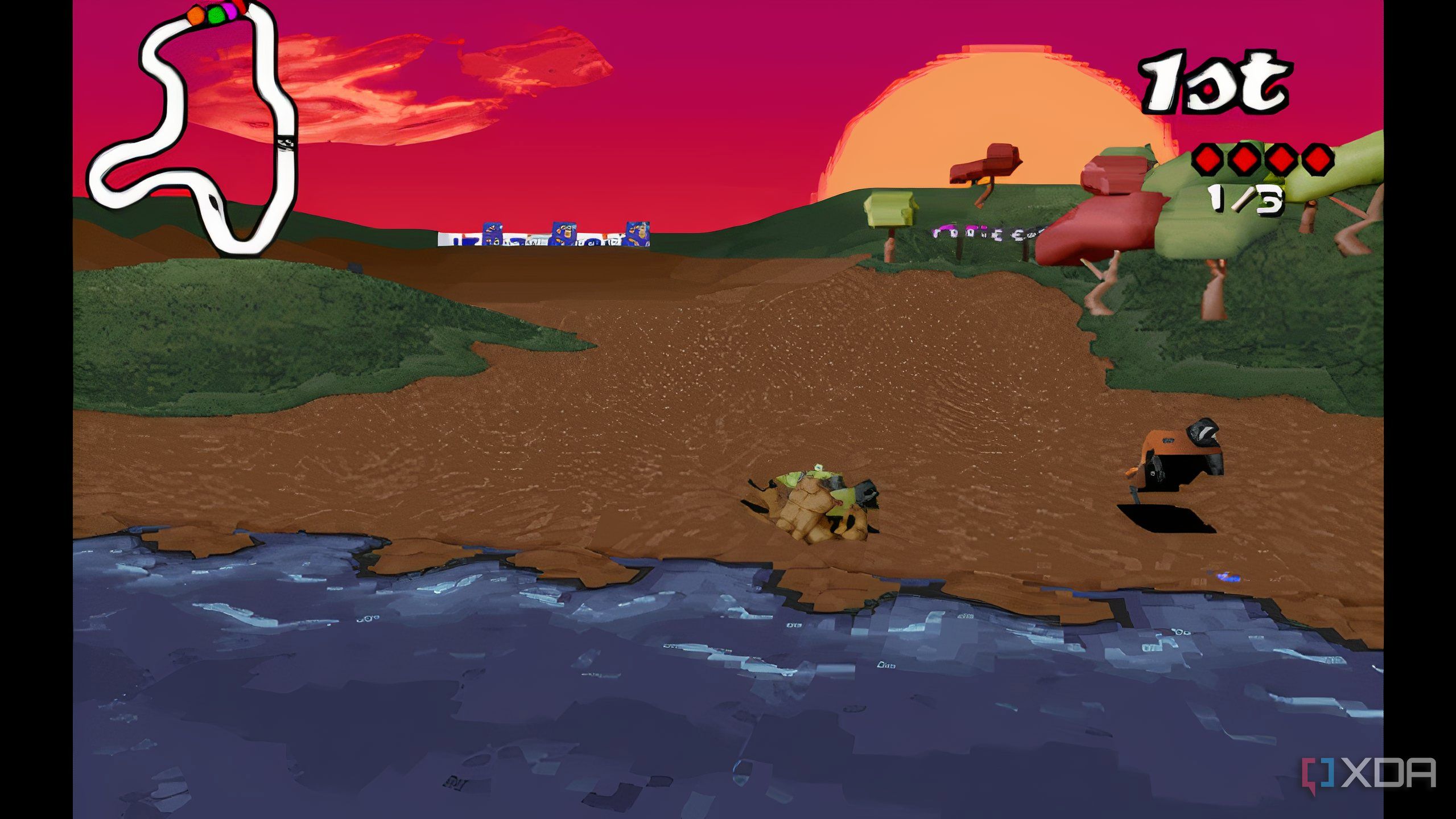 A screenshot from the game Big Red Racing, showing two cars jumping across a small river.
