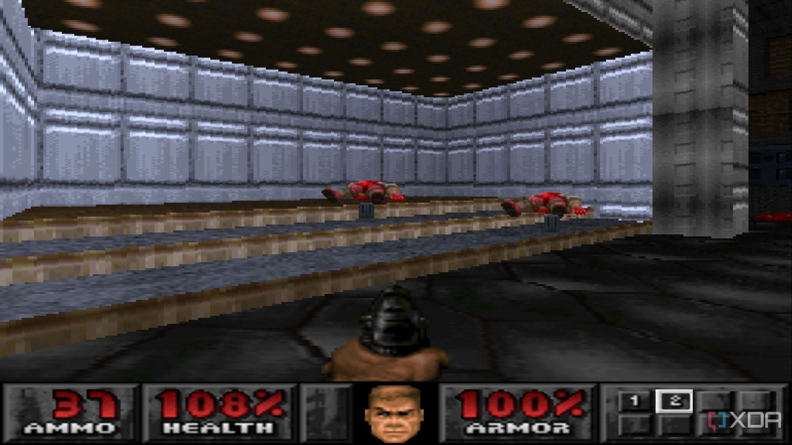 The Doom marine shooting down two demons with a pistol in PlayStation 1 game Doom.