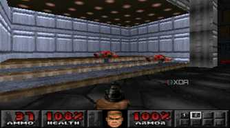 The Doom marine shooting down two demons with a pistol in PlayStation 1 game Doom.