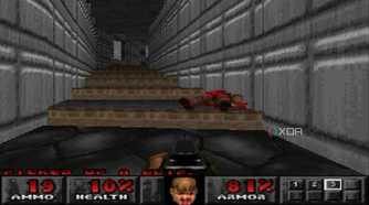 The Doom Marine using a shotgun on a demon in PlayStation 1 game Doom.