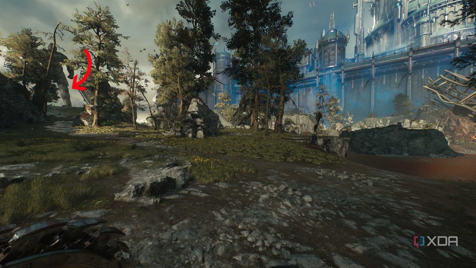 An arrow pointing to a barely visible statue in Doom: The Dark Ages.
