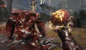 The Doom Slayer holding the heart of a Mancubus in Doom: The Dark Ages.