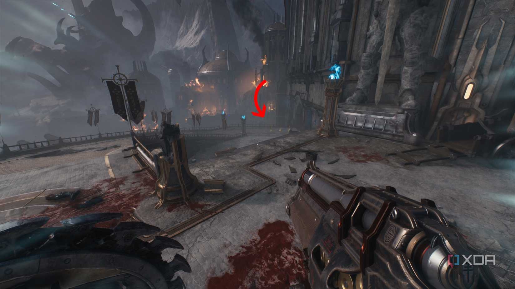 An arrow pointing towards gold bars down some stairs in Doom: The Dark Ages.