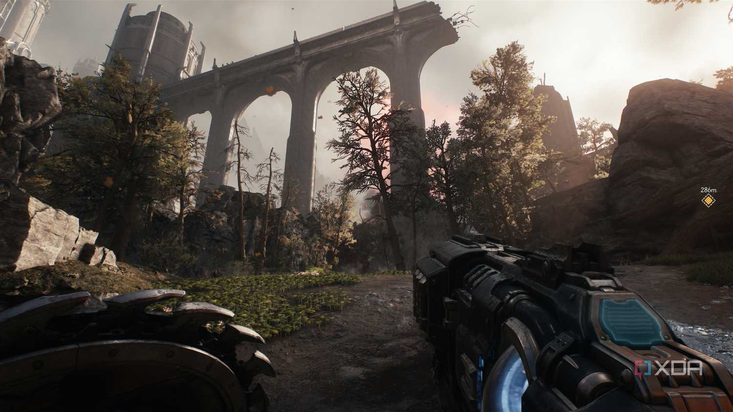 A broken bridge in the middle of a grassland in Doom: The Dark Ages.