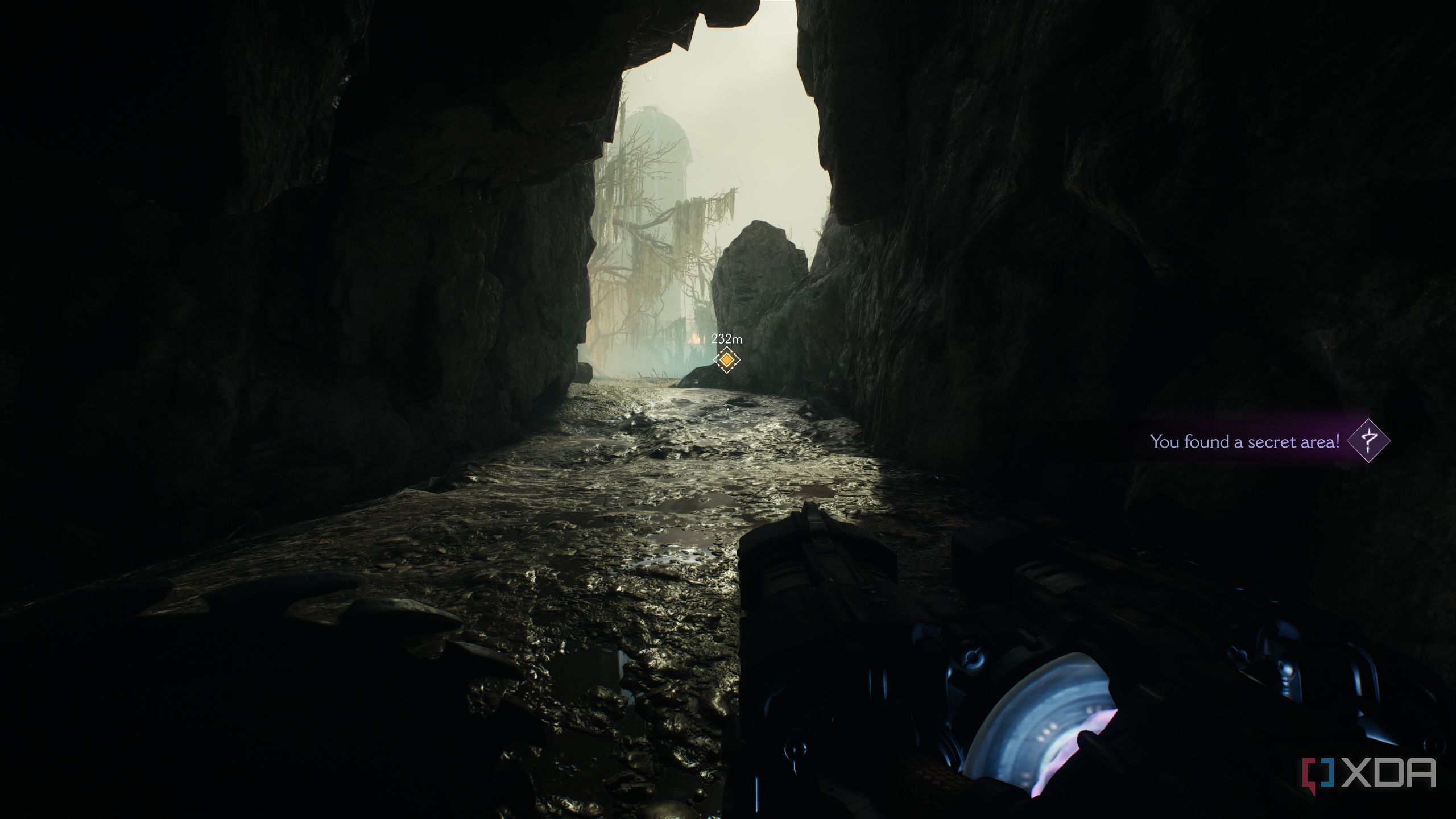 A dark cave with sunlight pouring in, in Doom: The Dark Ages.