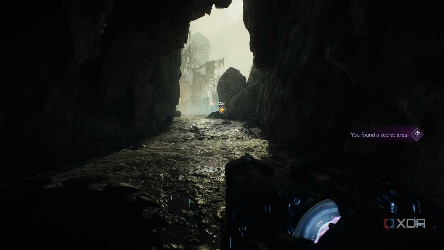 A dark cave with sunlight pouring in, in Doom: The Dark Ages.
