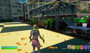 A high school in Fortnite with a stage and a ping-pong table.
