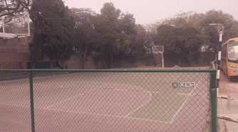 A photograph of a high-school basketball court.