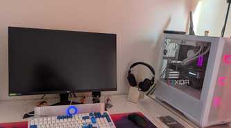 A gaming PC setup with a black screen on the monitor