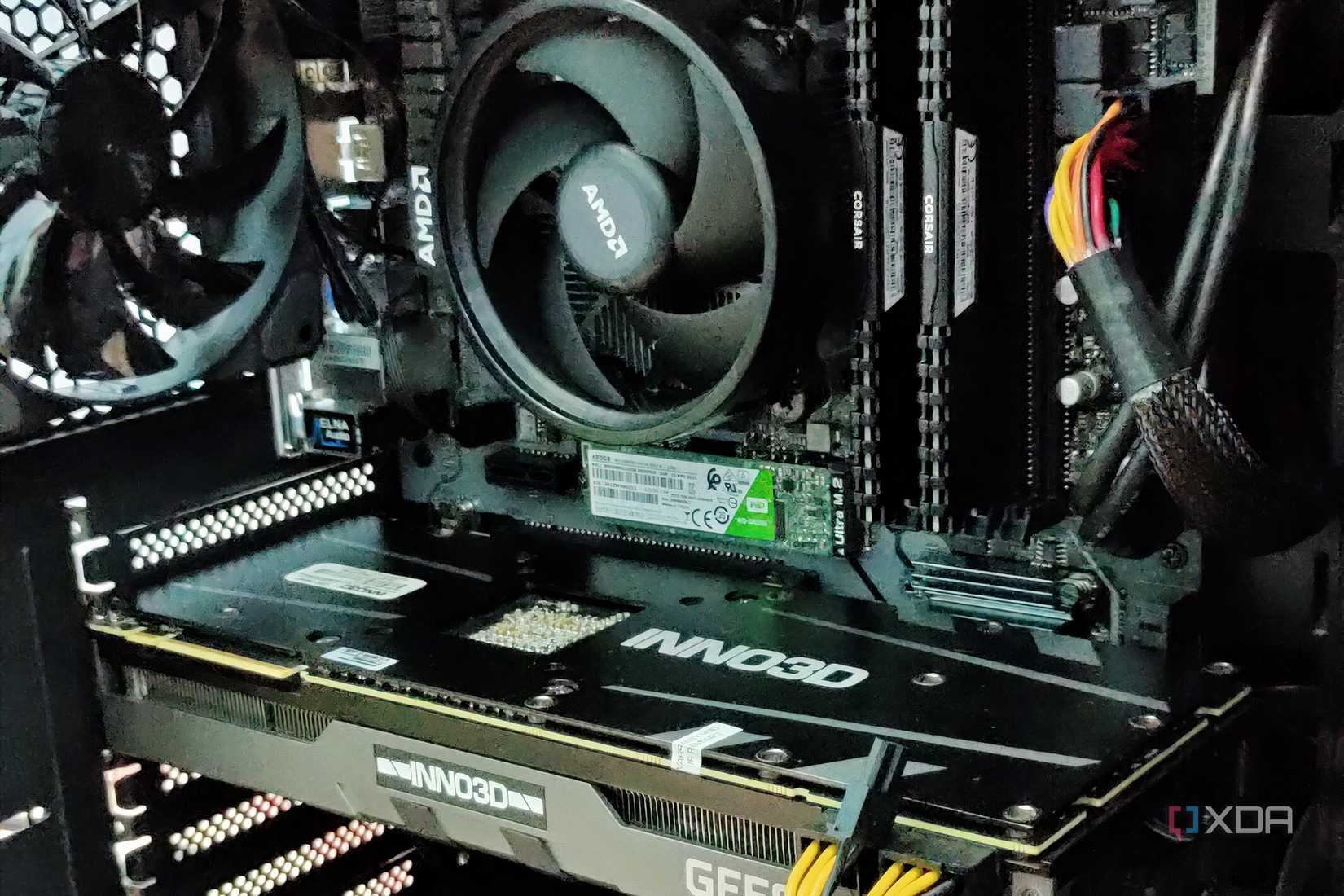 Gaming PC showing a GPU, CPU cooler, RAM, and SSD