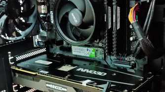 Gaming PC showing a GPU, CPU cooler, RAM, and SSD