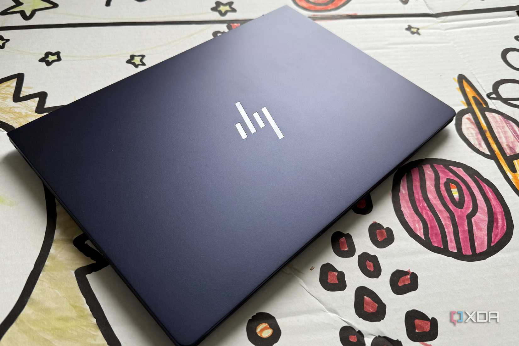 HP EliteBook Ultra G1i AI on a cardboard bus