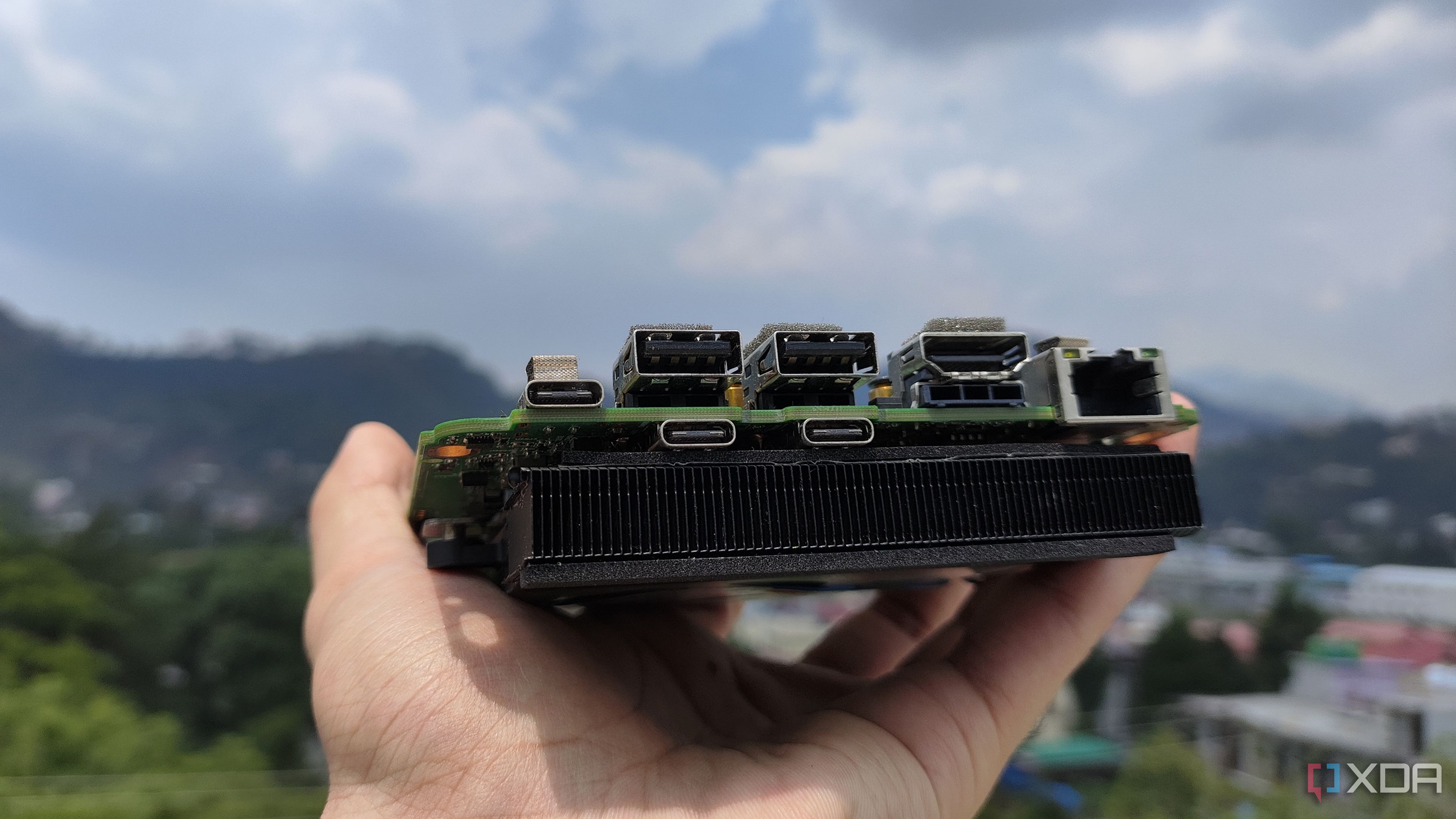 A person holding an Intel N100 mini PC