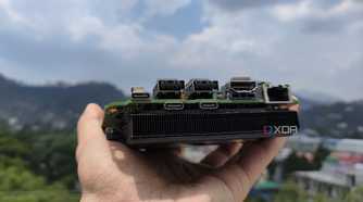 A person holding an Intel N100 mini-PC