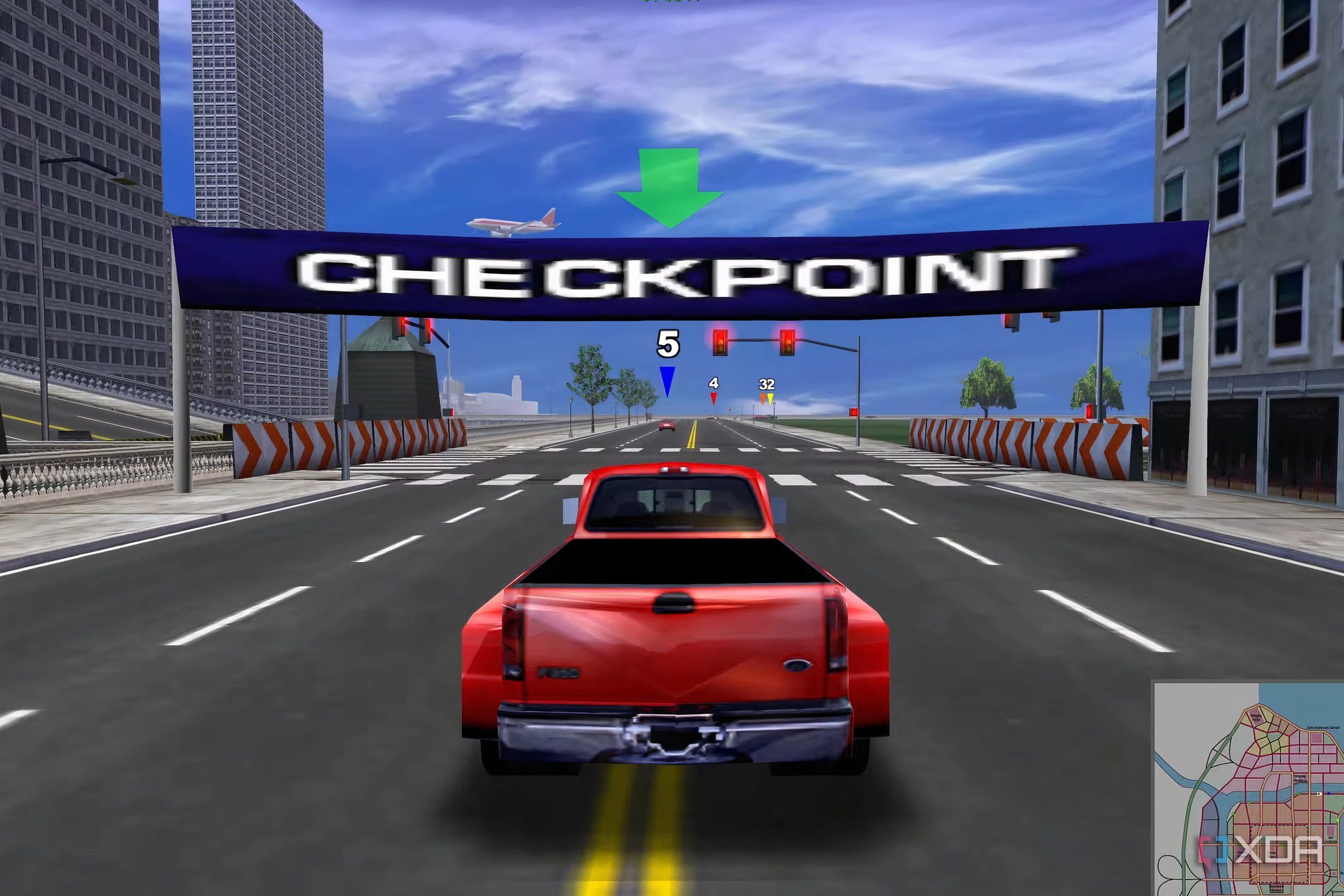 A screenshot from the game Midtown Madness, showing a red Ford F-350 truck racing towards a checkpoint.