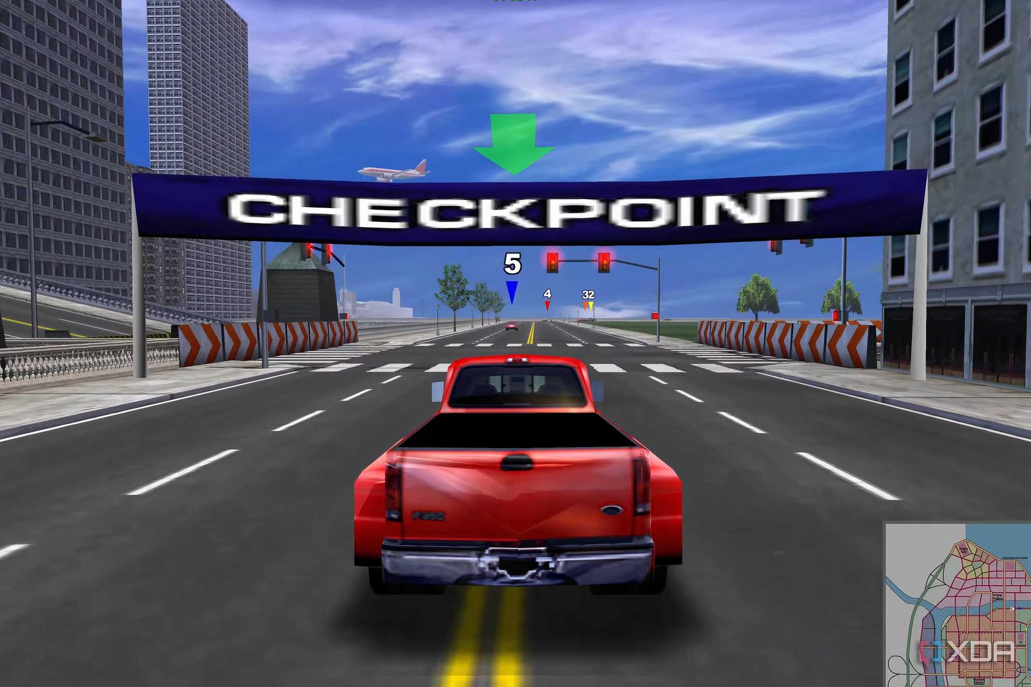 A screenshot from the game Midtown Madness, showing a red Ford F-350 truck racing towards a checkpoint.