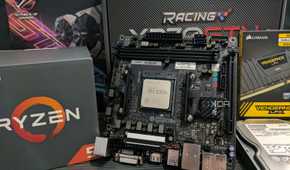 An AMD AM4 motherboard with a CPU installed onto it.