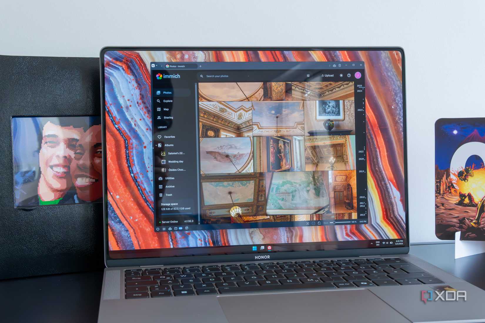 A laptop displaying photos hosted in Immich