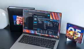 A laptop connected Proxmox and TrueNAS dashboards on the web