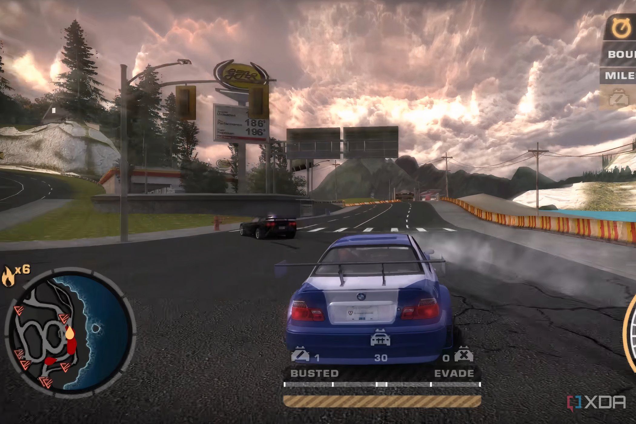 The BMW M3 GTR being chased by cops in Need for Speed: Most Wanted.
