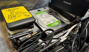 plastic storage with old hard drives
