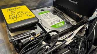 plastic storage with old hard drives