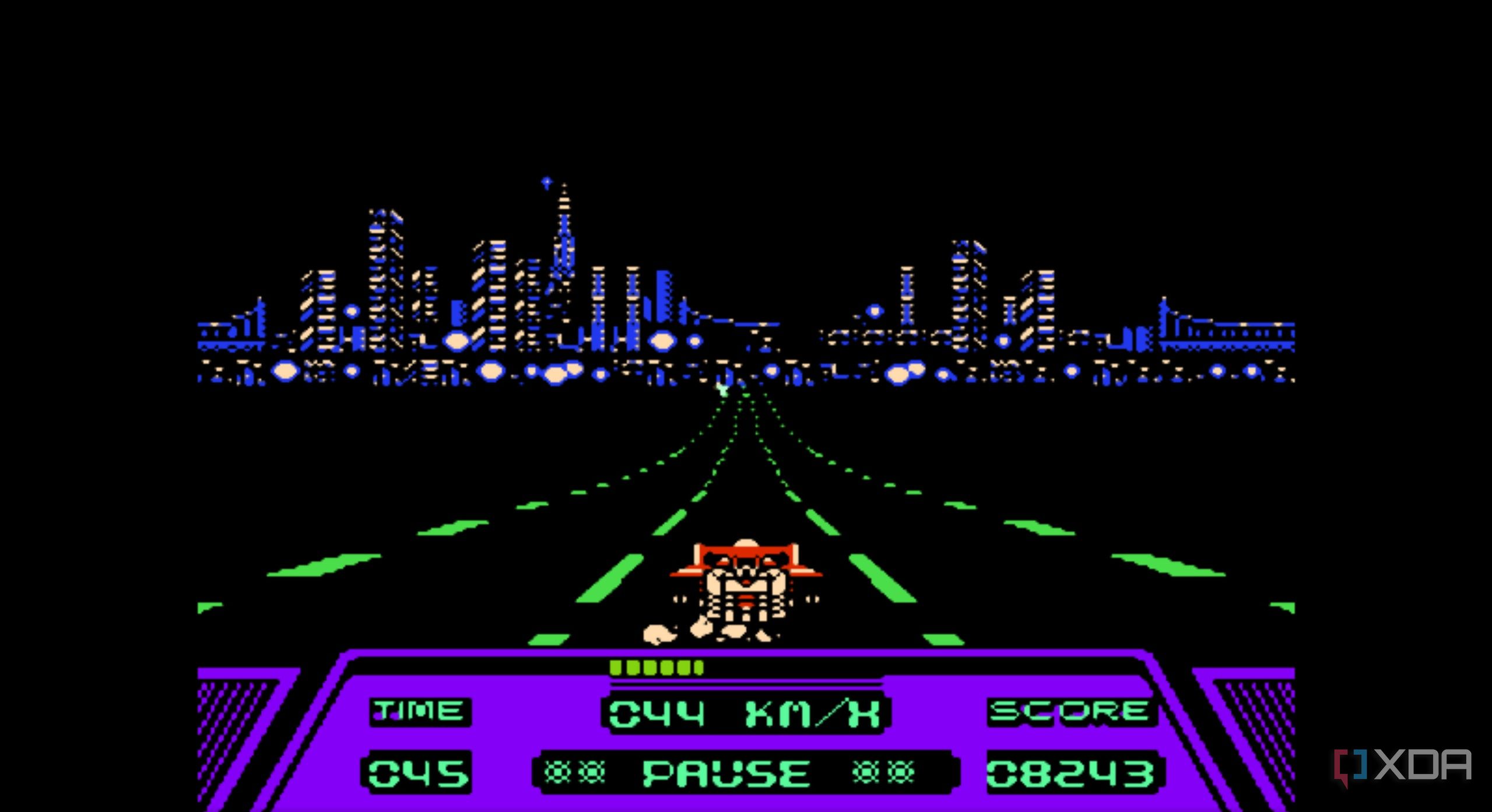 A screenshot from the game Rad Racer running on a NES emulator, showing a red Formula 1 car racing down a highway during nighttime, while the San Francisco skyline looms ahead.