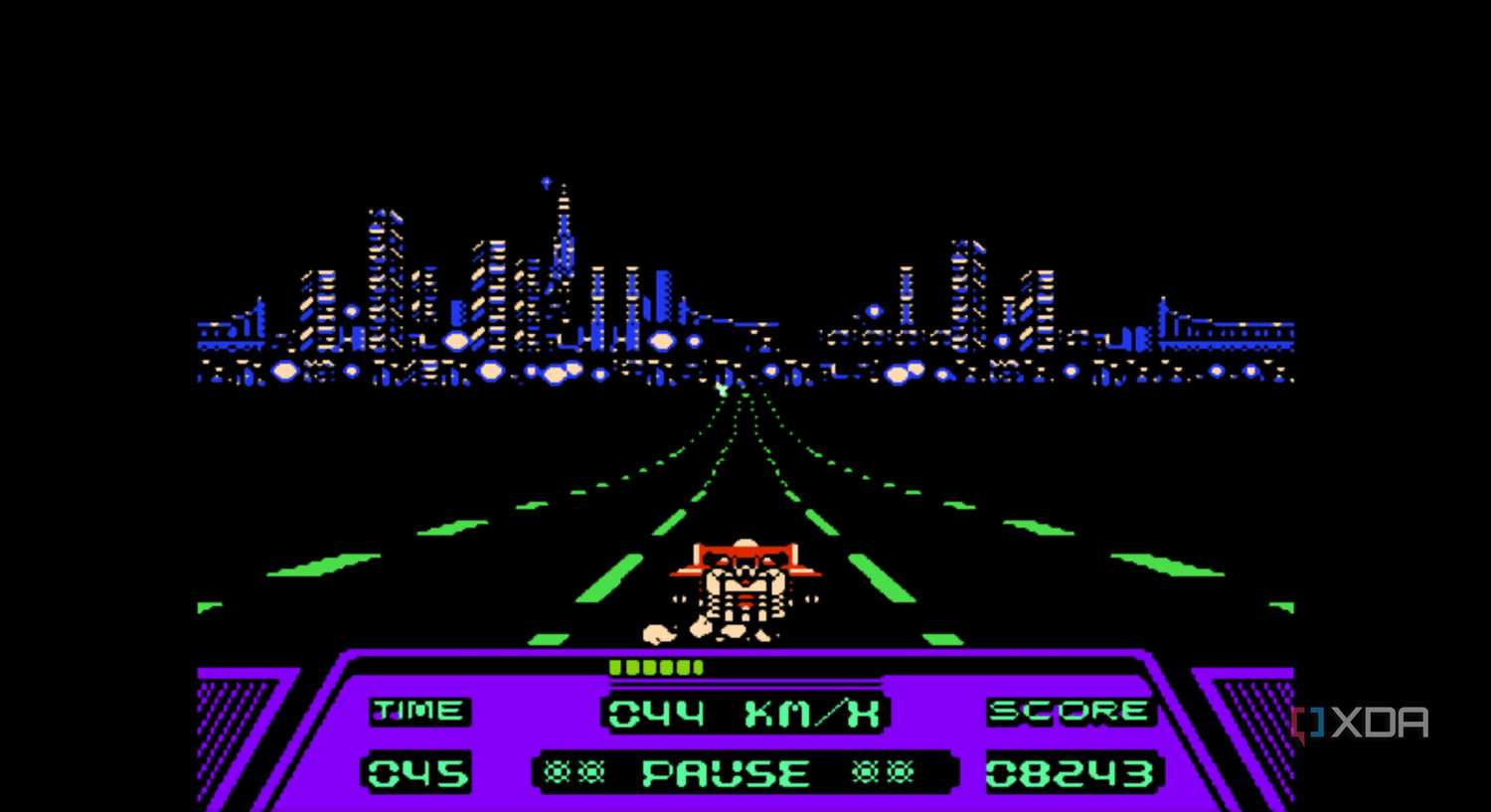 A screenshot from the game Rad Racer running on a NES emulator, showing a red Formula 1 car racing down a highway during nighttime, while the San Francisco skyline looms ahead.