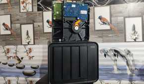 Refurbished drives resting on top of a NAS