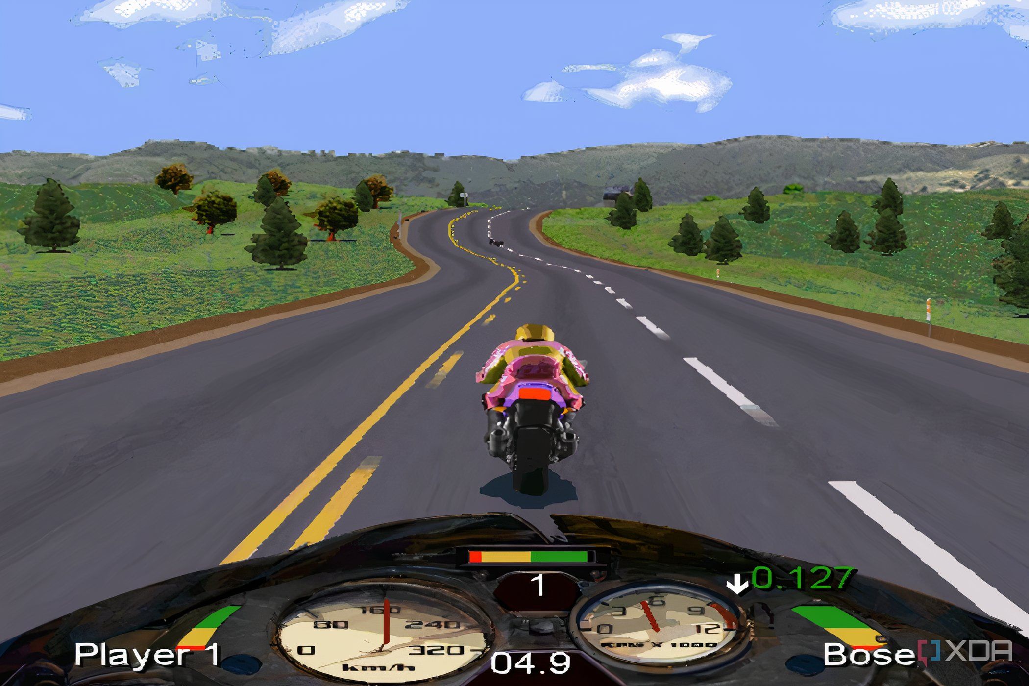 A screenshot from the game Road Rash, showing a bike racing down a road in the middle of grassy plains.