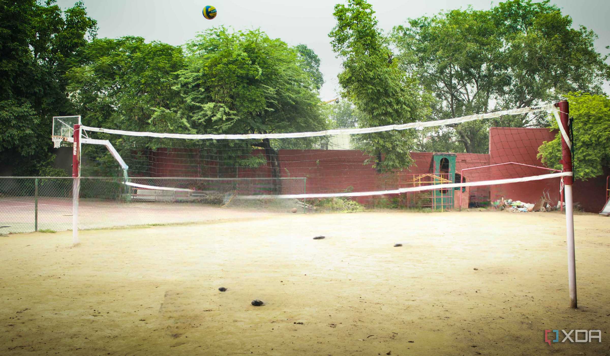 A photograph of a high-school volleyball court.