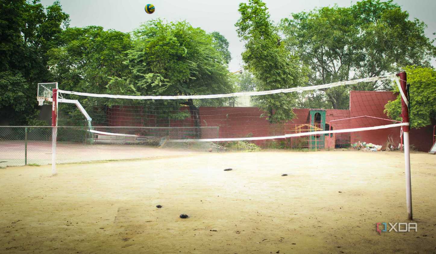 A photograph of a high-school volleyball court.
