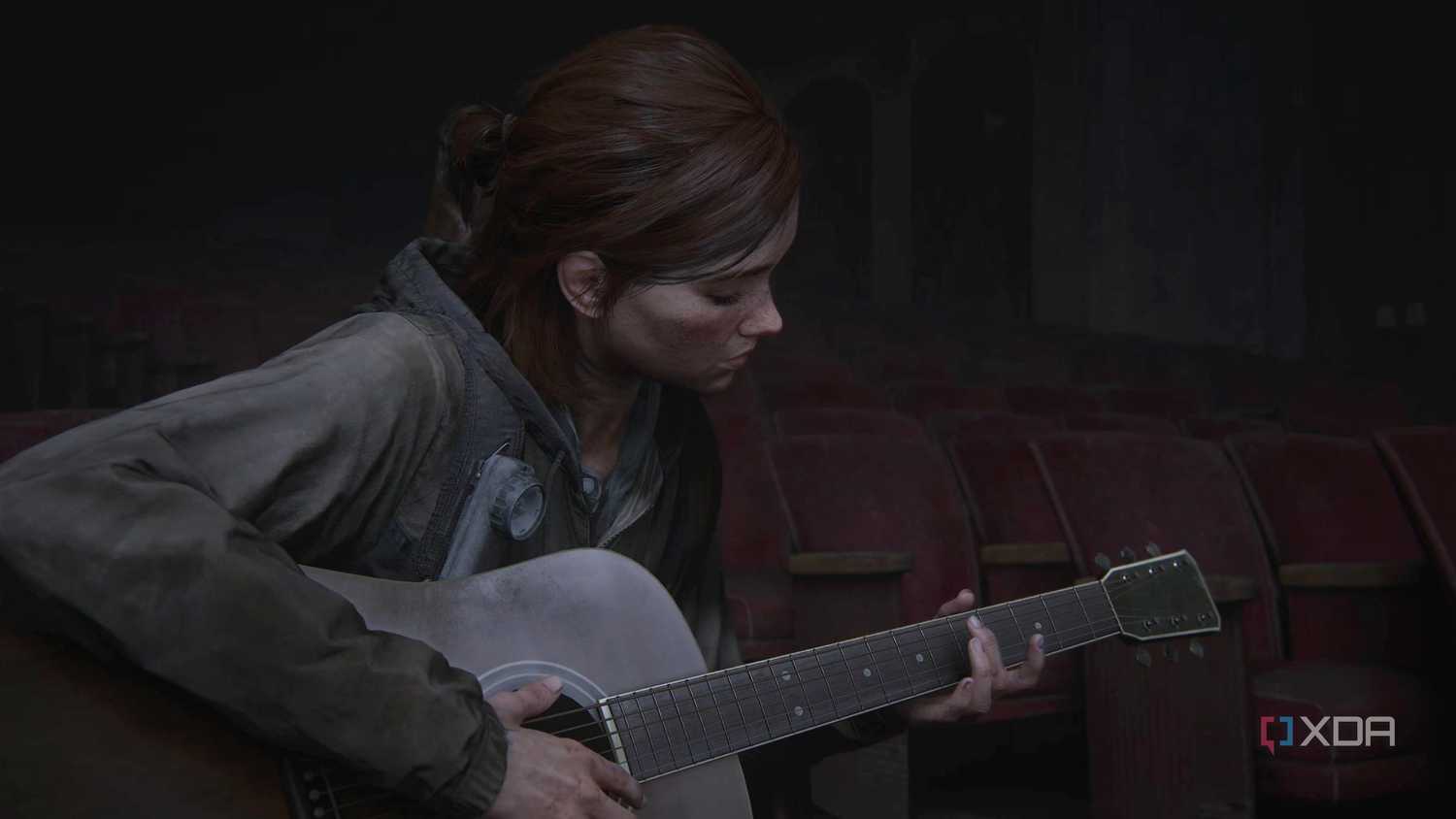 Ellie playing the guitar in The Last of Us Part II.