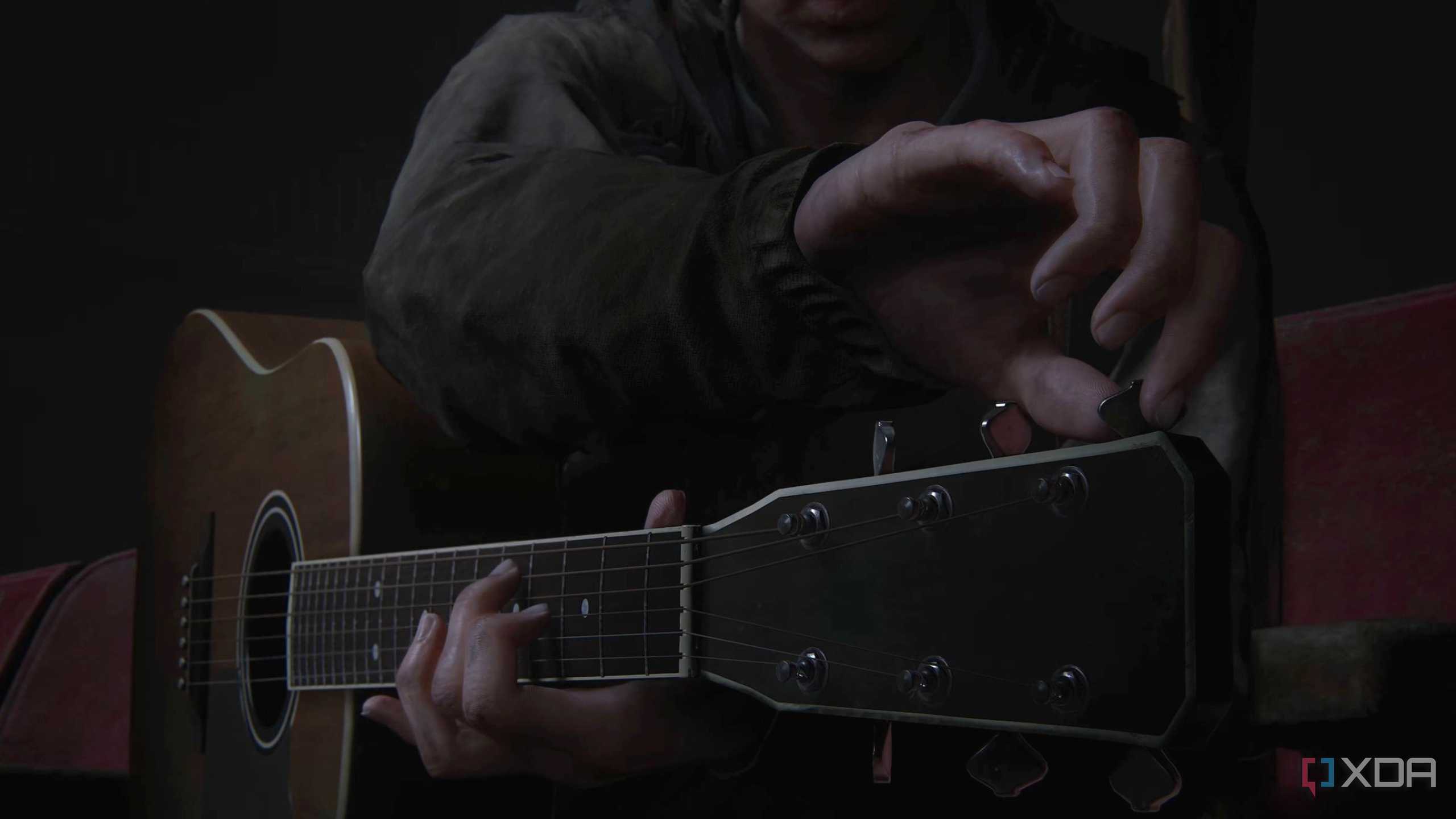 Ellie tuning the guitar in The Last of Us Part II.
