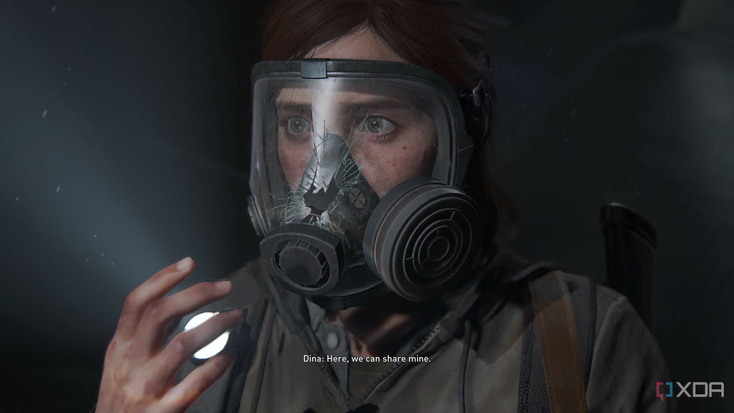 Ellie looking scared after her gas mask breaks in The Last of Us Part II. 
