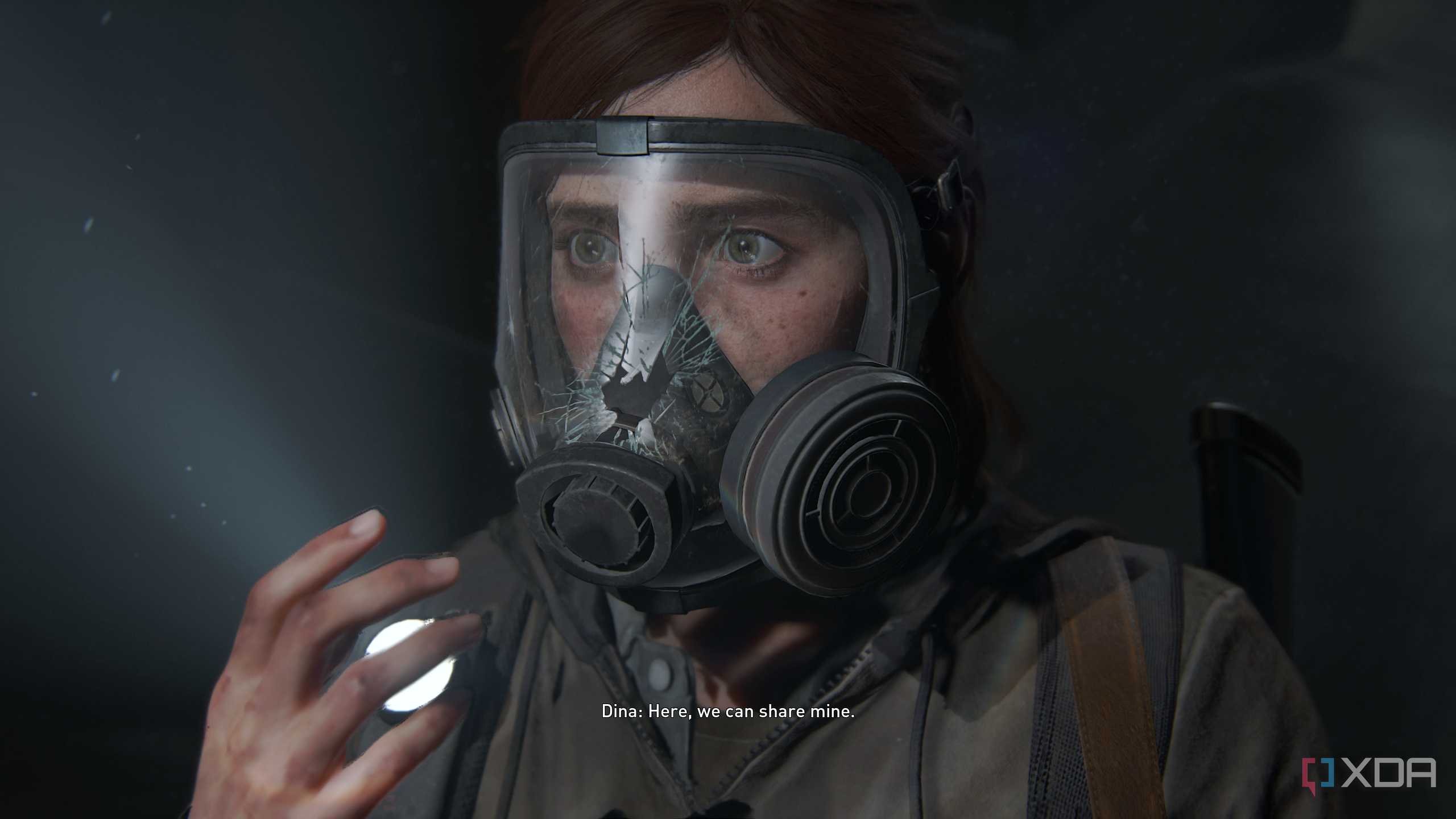 Ellie looking scared after her gas mask breaks in The Last of Us Part II.