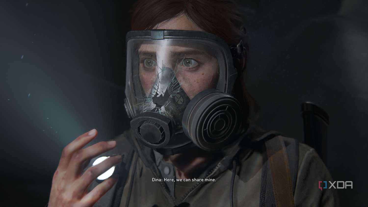 Ellie looking scared after her gas mask breaks in The Last of Us Part II.