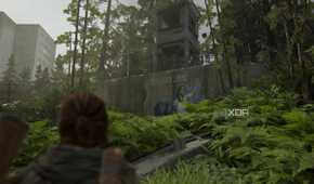 Ellie looking at a Seraphite mural in The Last of Us Part II Remastered.
