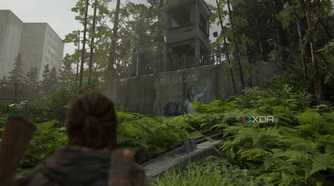 Ellie looking at a Seraphite mural in The Last of Us Part II Remastered.