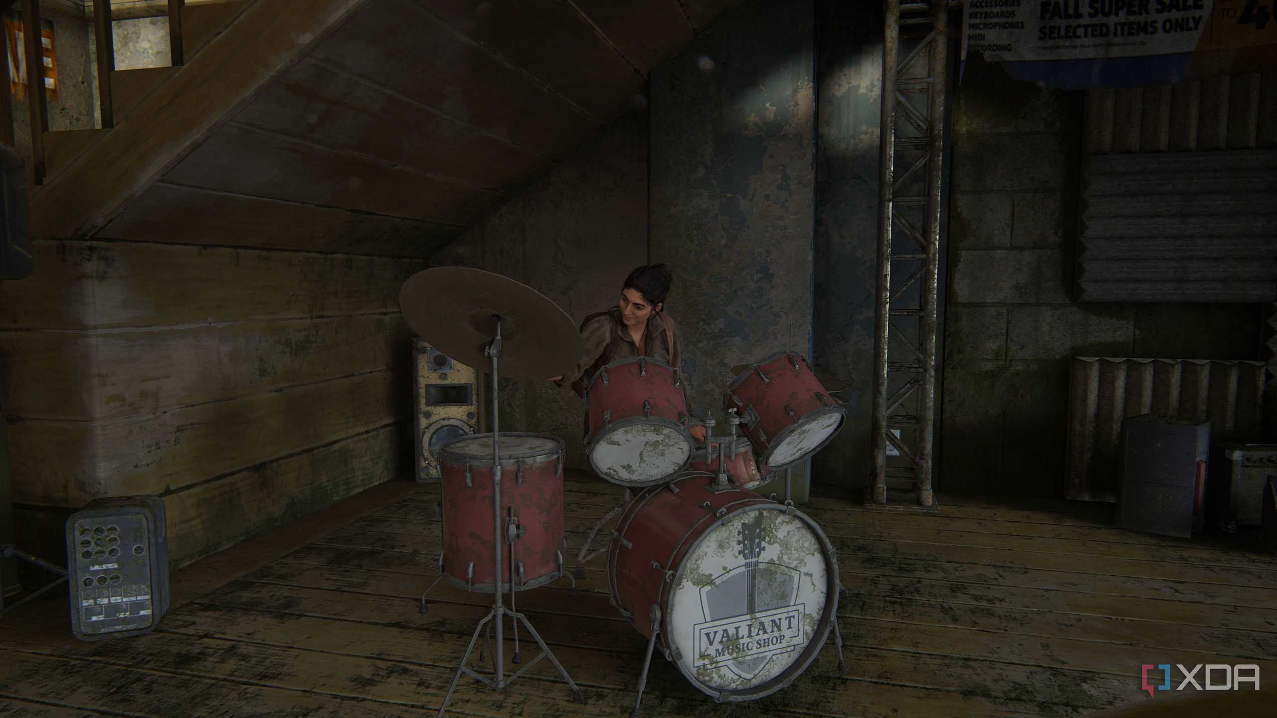 An image from the game The Last of Us Part II Remastered on PC, showing Dina playing the drums in a music shop.