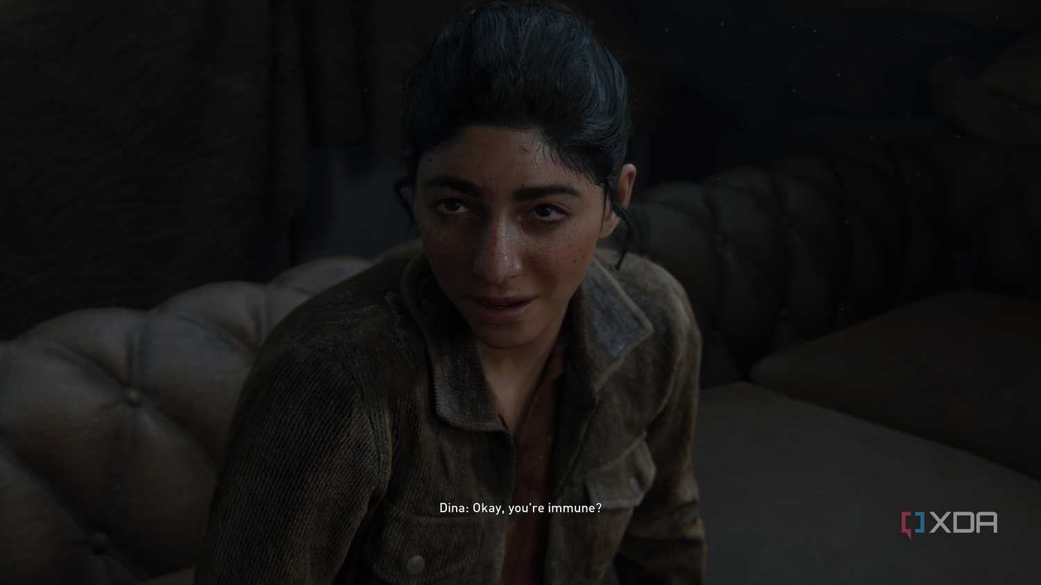 An image from the game The Last of Us Part II Remastered on PC, showing Dina scoffing at Ellie.