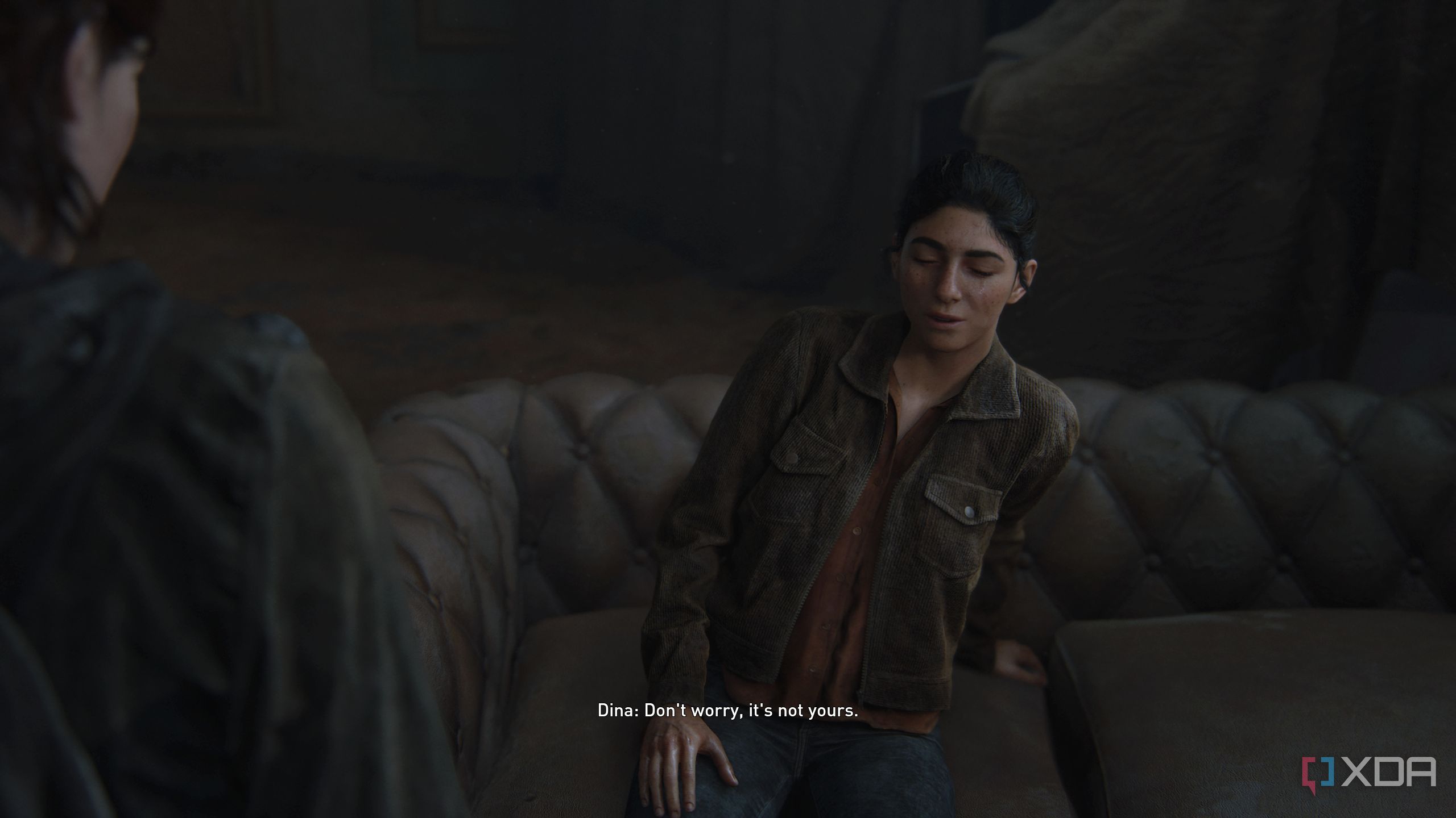 An image from the game The Last of Us Part II Remastered on PC, showing Dina crying and making a joke.